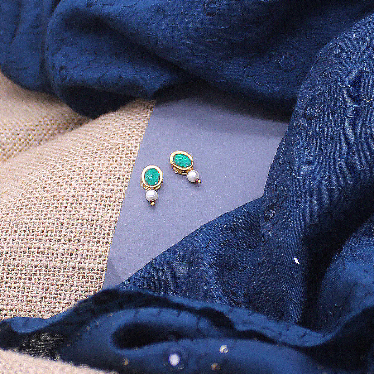 Oval shape stone decorated earrings for idols