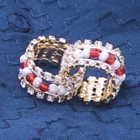 Pink moti and stone decorated kangan/handcuff for idols