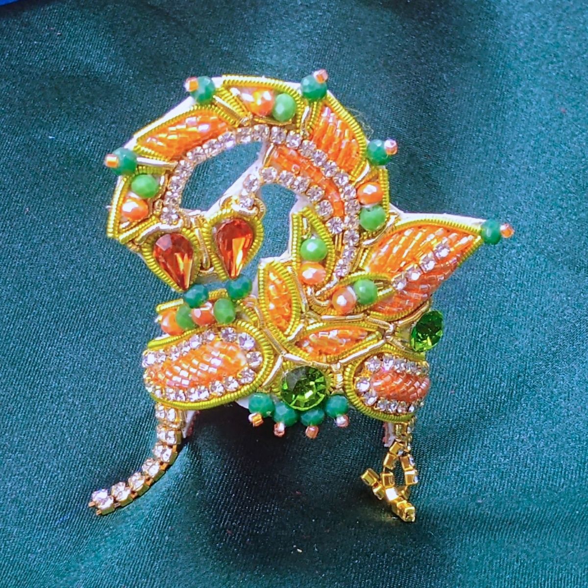 Zari work heavy decorated orange mukut for Idols