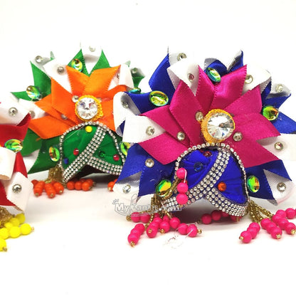 Heavy ribbon and latkan mukut for kanha ji. This laddu gopal Heavy ribbon and latkan mukut is available in multiple colors and sizes.